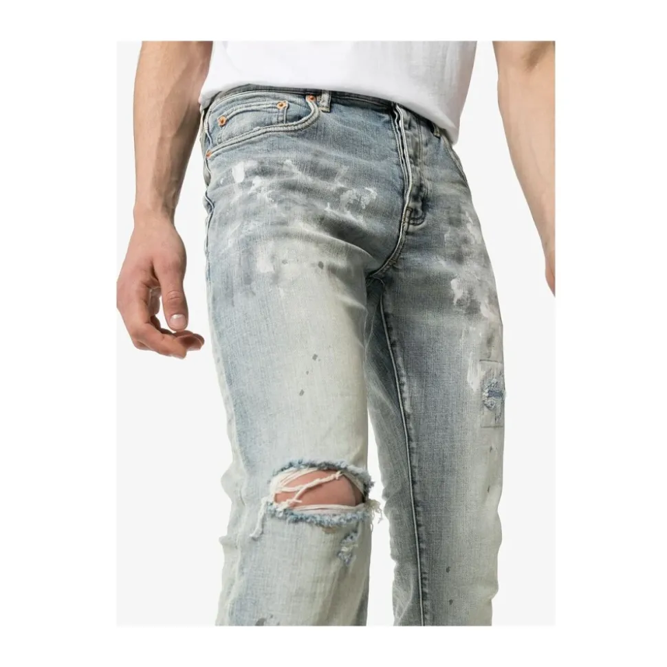Białe pomalowane jeansy slim fit