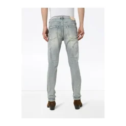 Białe pomalowane jeansy slim fit